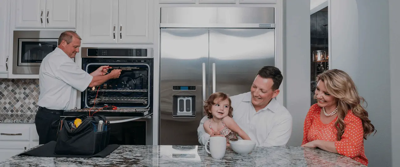 Appliance repair technician fixing a residential washing machine