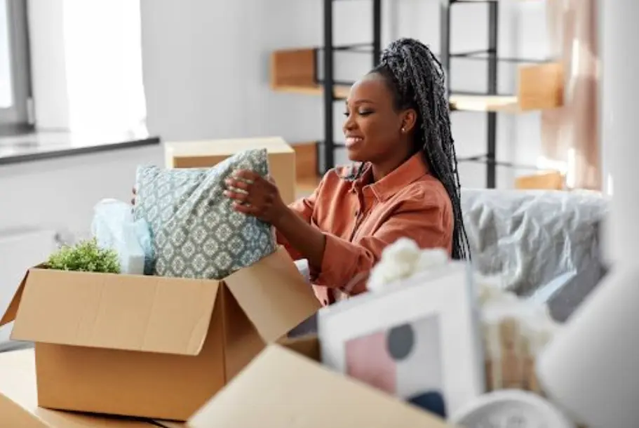 Moving crew carefully loading furniture into a moving truck