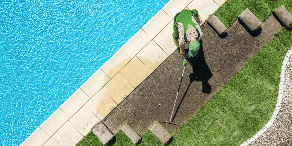 Pool technician testing and balancing water chemistry in a backyard pool